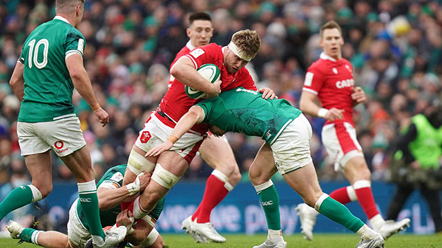 Aaron Wainwright is tackled by Ireland players in 2022 Six Nations