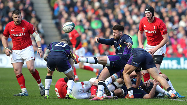 Ali Price kicks the ball for Scotland against Wales during 2019 Six Nations