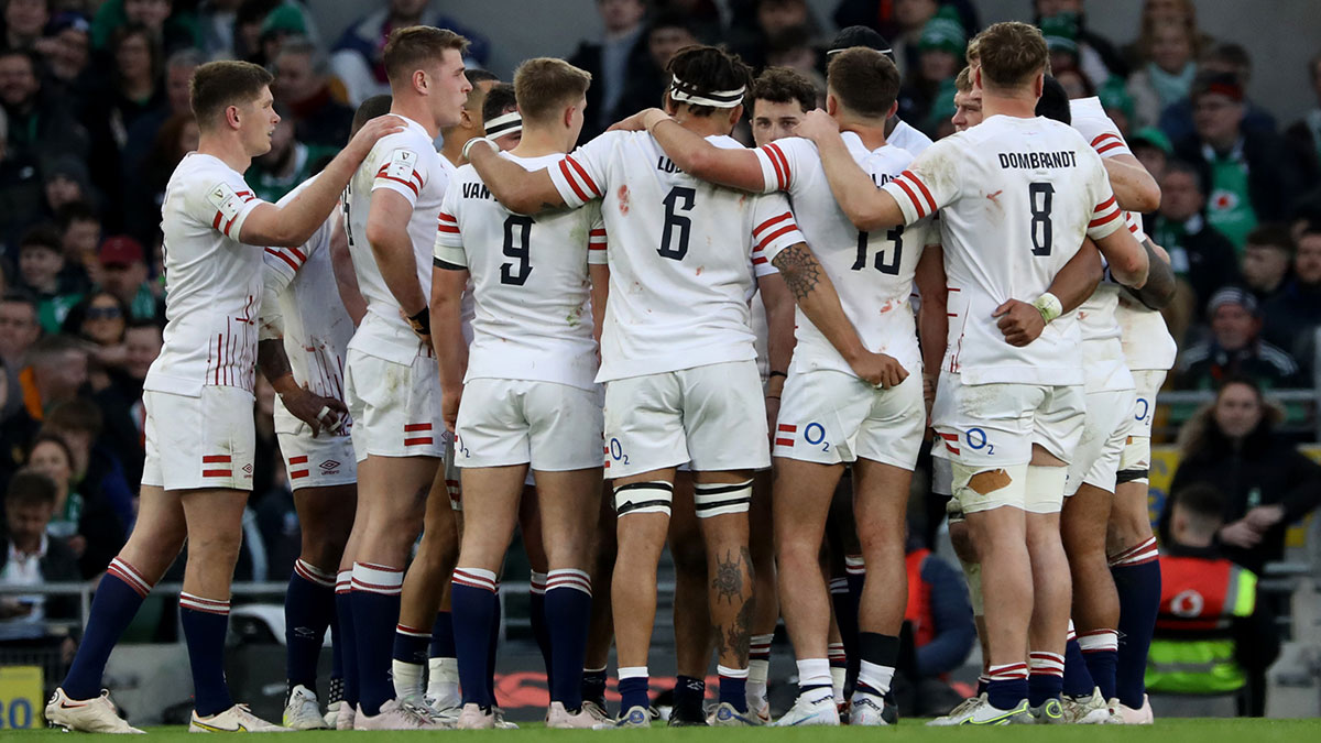England players in a huddle during Ireland match in 2023 Six Nations