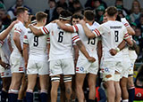 England players in a huddle during Ireland match in 2023 Six Nations