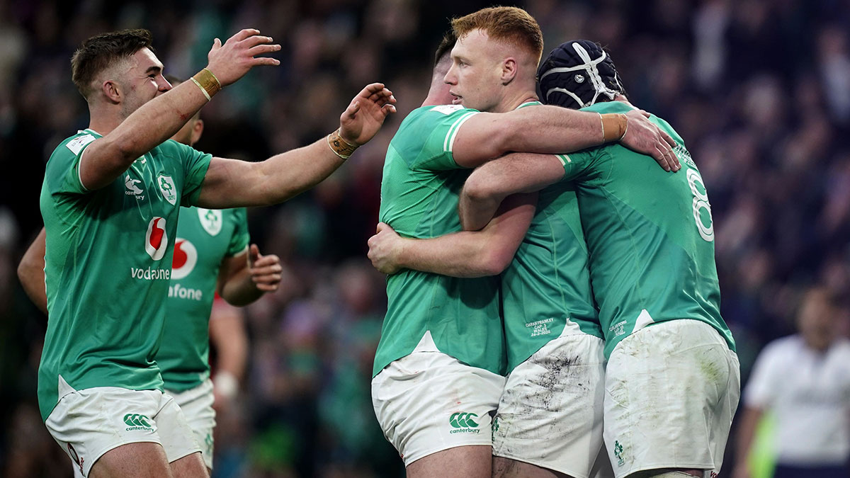 Ireland players celebrate Ciaran Frawley try against Wales in 2024 Six Nations