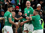Ireland players celebrate scoring a try against Wales in 2020 Six Nations