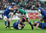 Ireland's Robbie Henshaw grapples with a host of French players