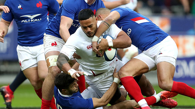 Manu Tuilagi is tackled by French players during France v England in 2020 Six Nations