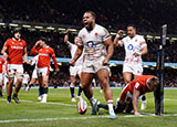 Ollie Lawrence celebrates his try for England against Wales in 2023 Six Nations