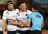 Owen Farrell speaks with the referee during the Saracens v Gloucester match