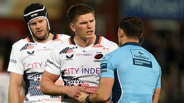 Owen Farrell speaks with the referee during the Saracens v Gloucester match