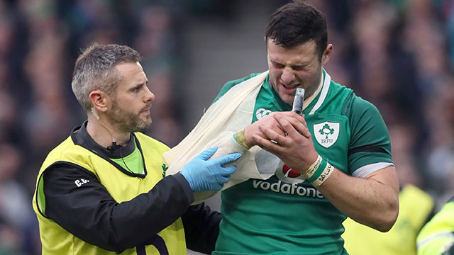 Robbie Henshaw is helped off the field after suffering a shoulder injury against Italy