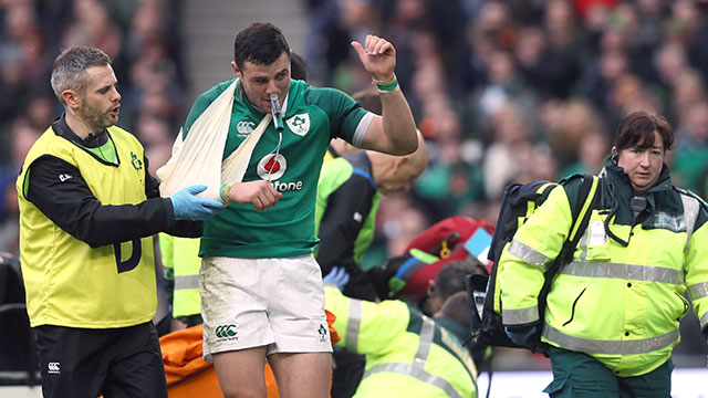 Robbie Henshaw is helped off the field after suffering a shoulder injury against Italy