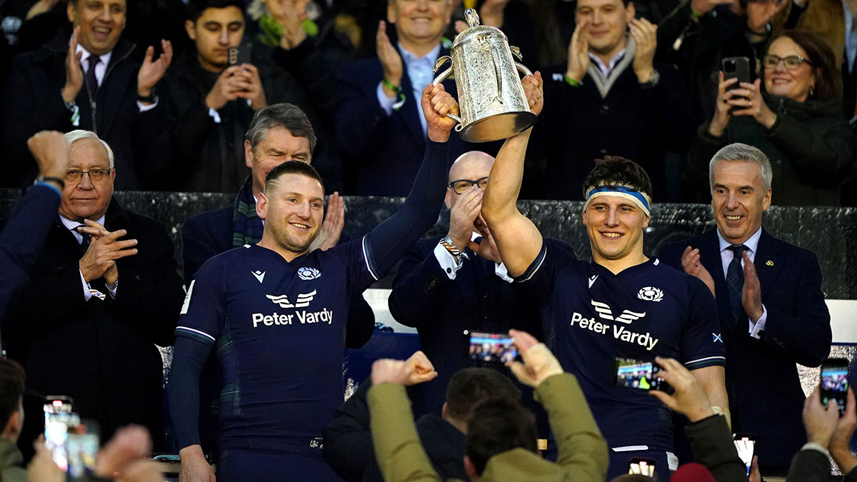 Scotland co captains hold Calcutta Cup aloft after victory over England in 2024 Six Nations