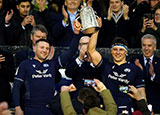 Scotland co captains hold Calcutta Cup aloft after victory over England in 2024 Six Nations