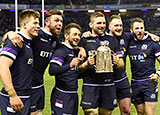 Scotland players celebrate with Calcutta Cup